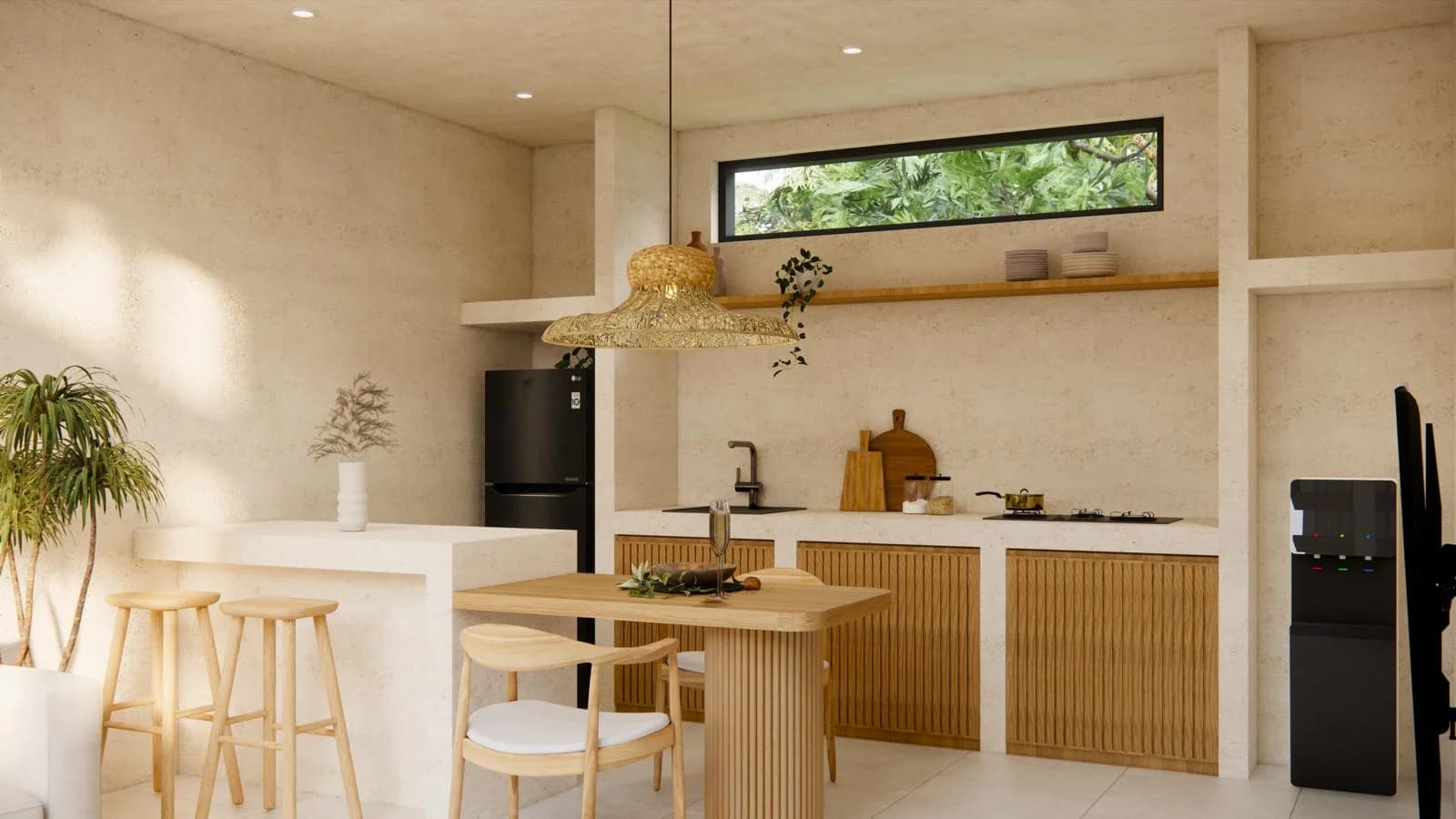 Open-plan kitchen and dining area with island counter in a Kuta Lombok villa