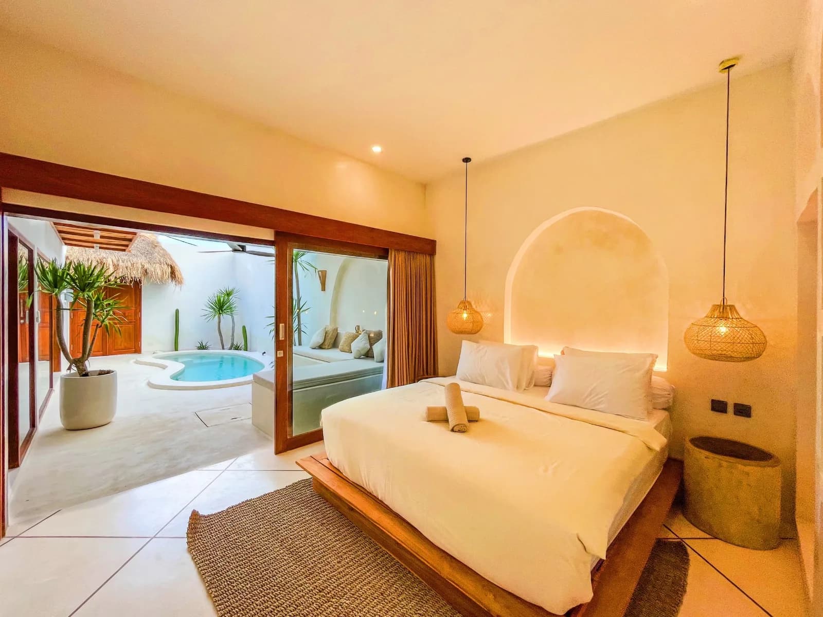 Bedroom opening onto the private pool at the built villa for sale in Kuta